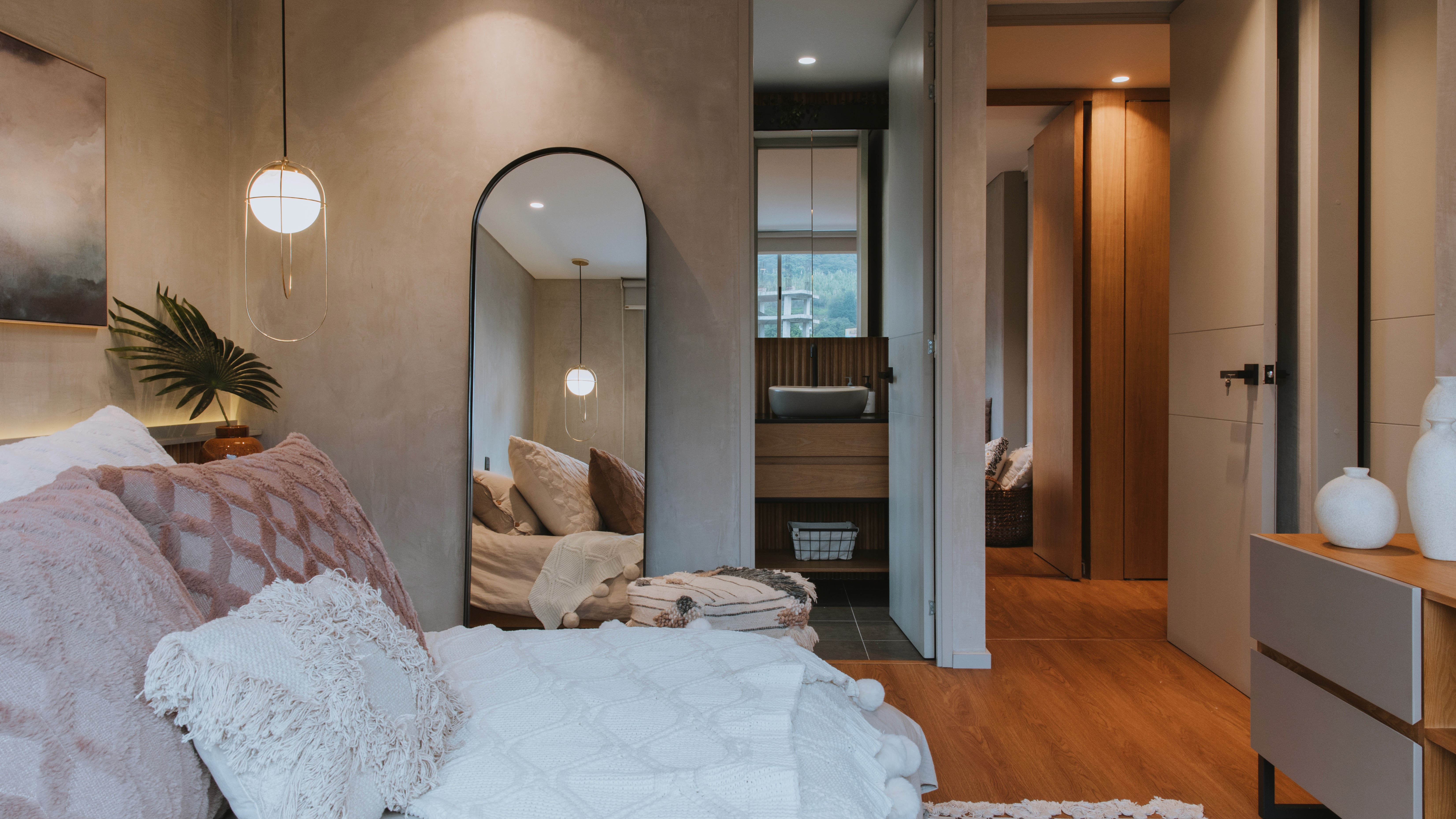 Double-height interior with flowing sculptural forms and warm raking light