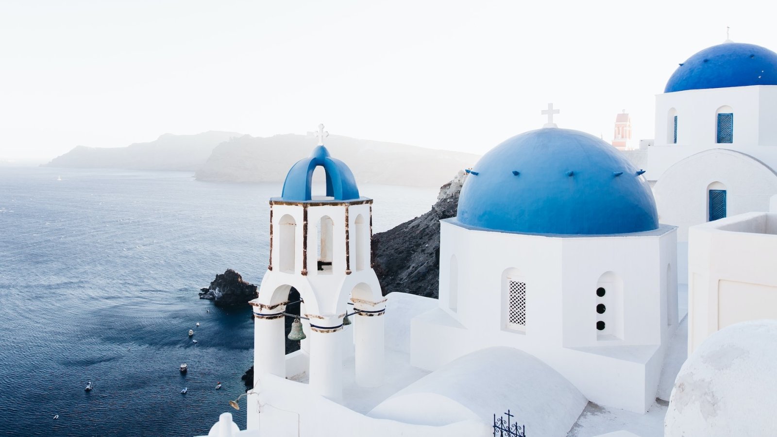 brown and white temple surrounded by green trees during daytime