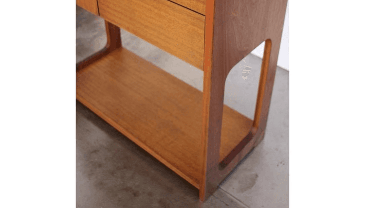 Base of wooden chifferobe with open side panels and toy box platform base.