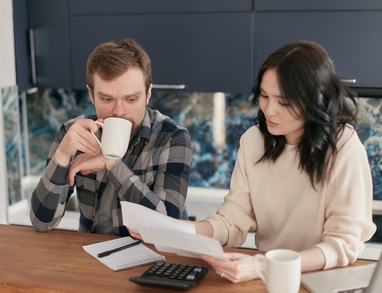 a man and a women in a meeting discussing something