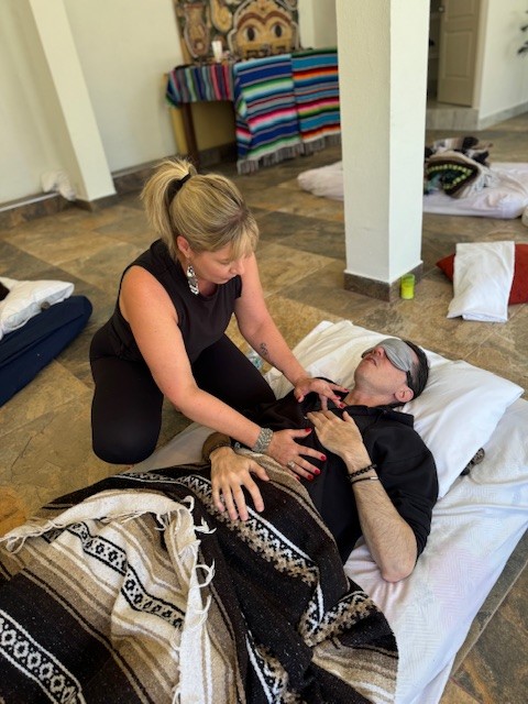 Female yoga instructor teaching a client