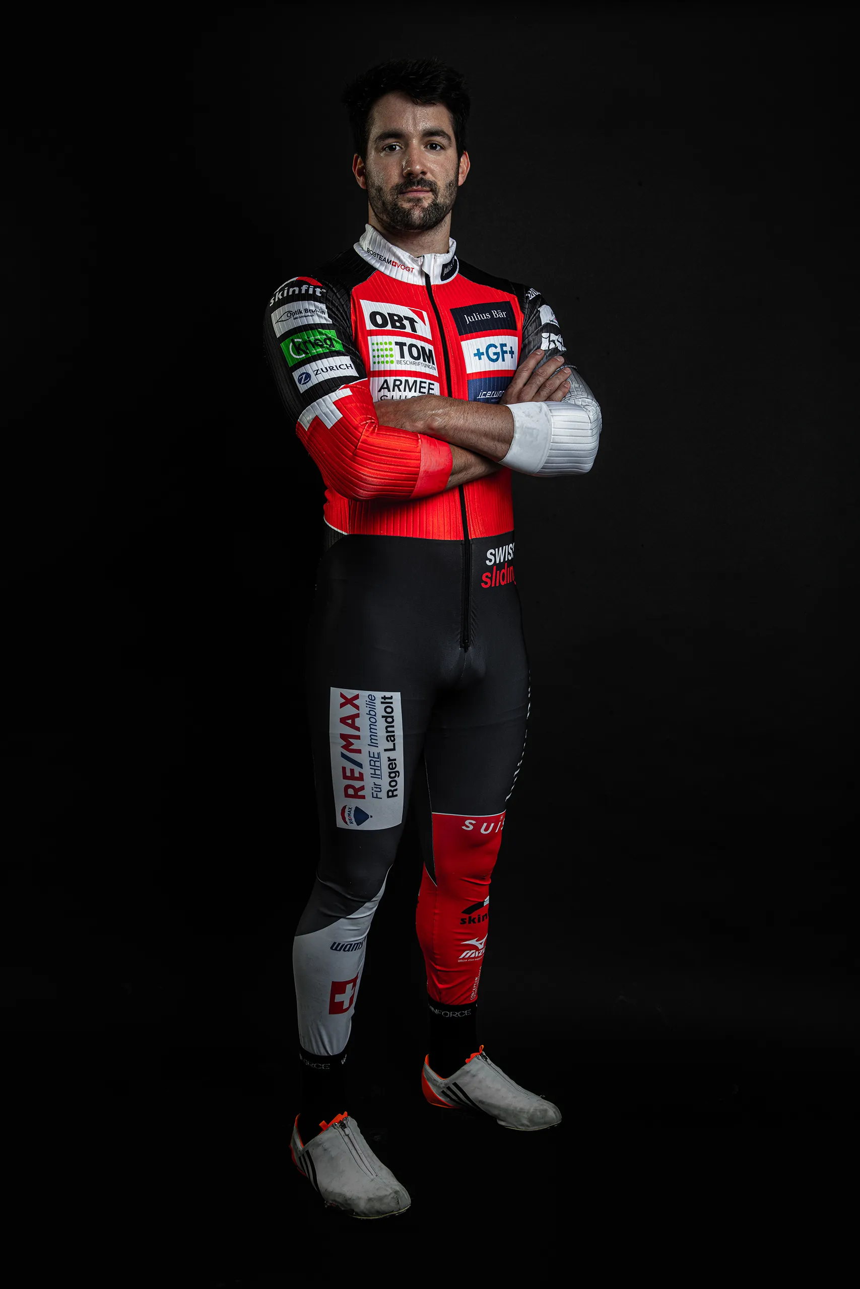 Full length standing portrait of a Bobteam Vogt athlete in full racing gear