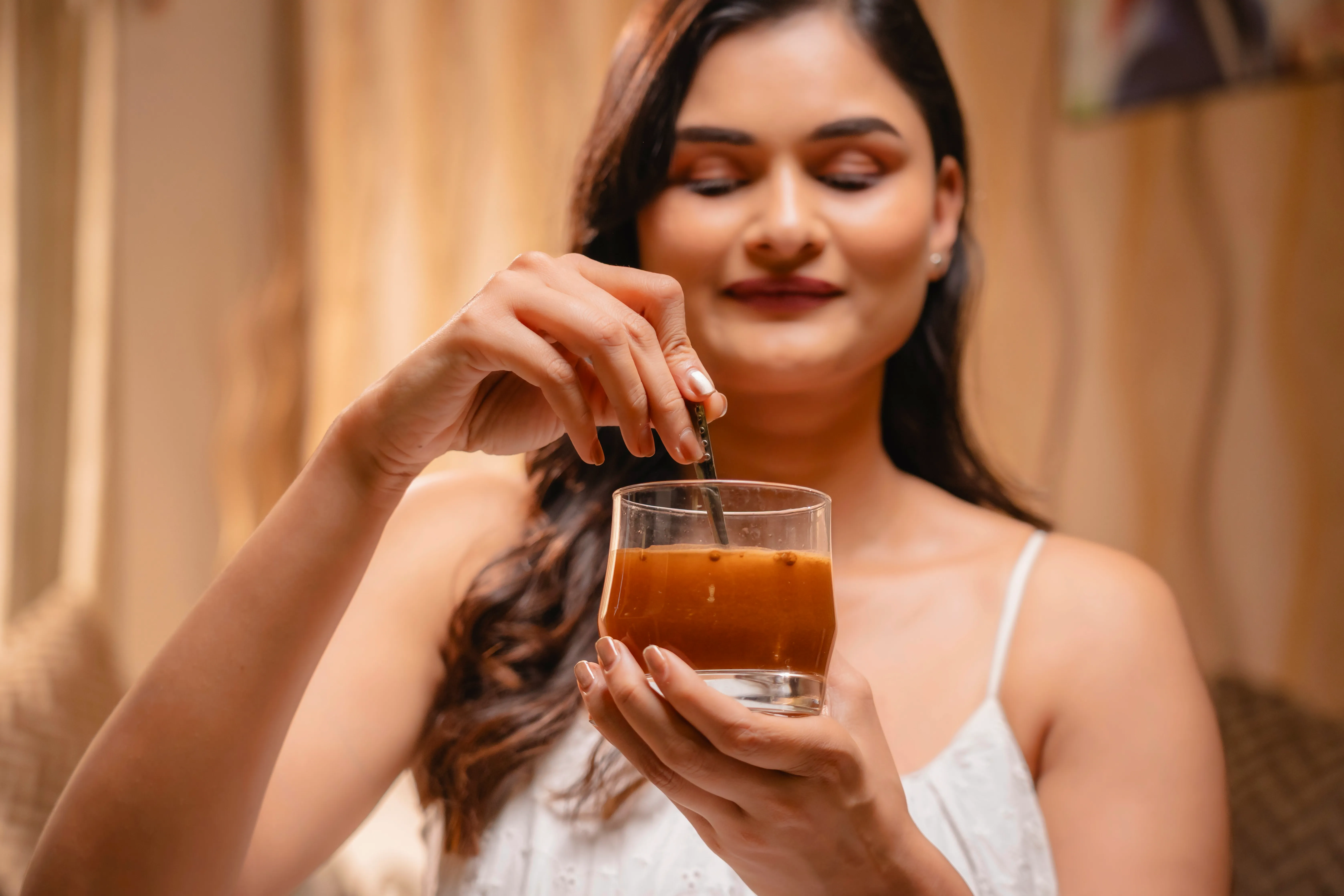 Portrait of woman holding Bionii product against clean background