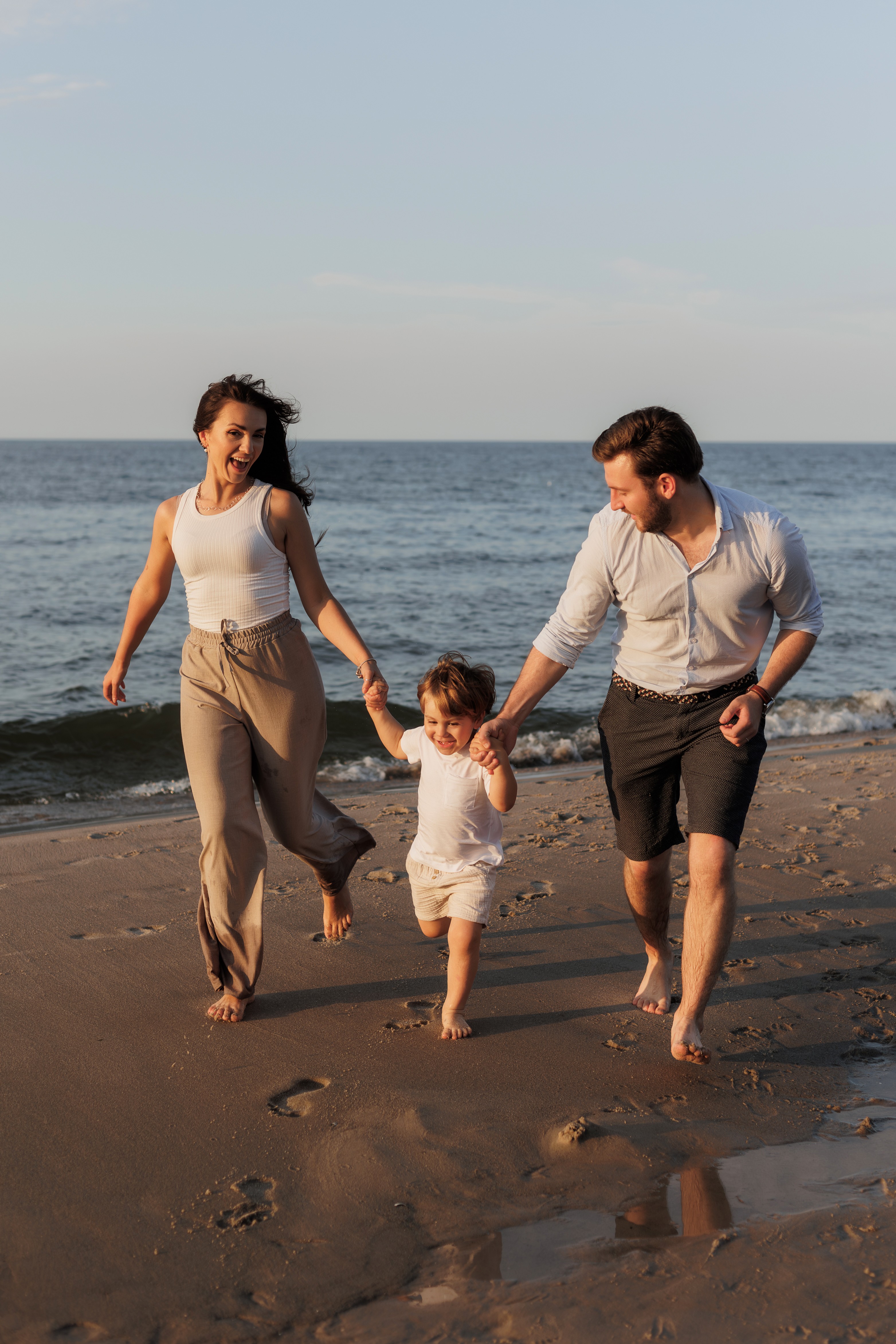 gray concrete dock bridge near seashore