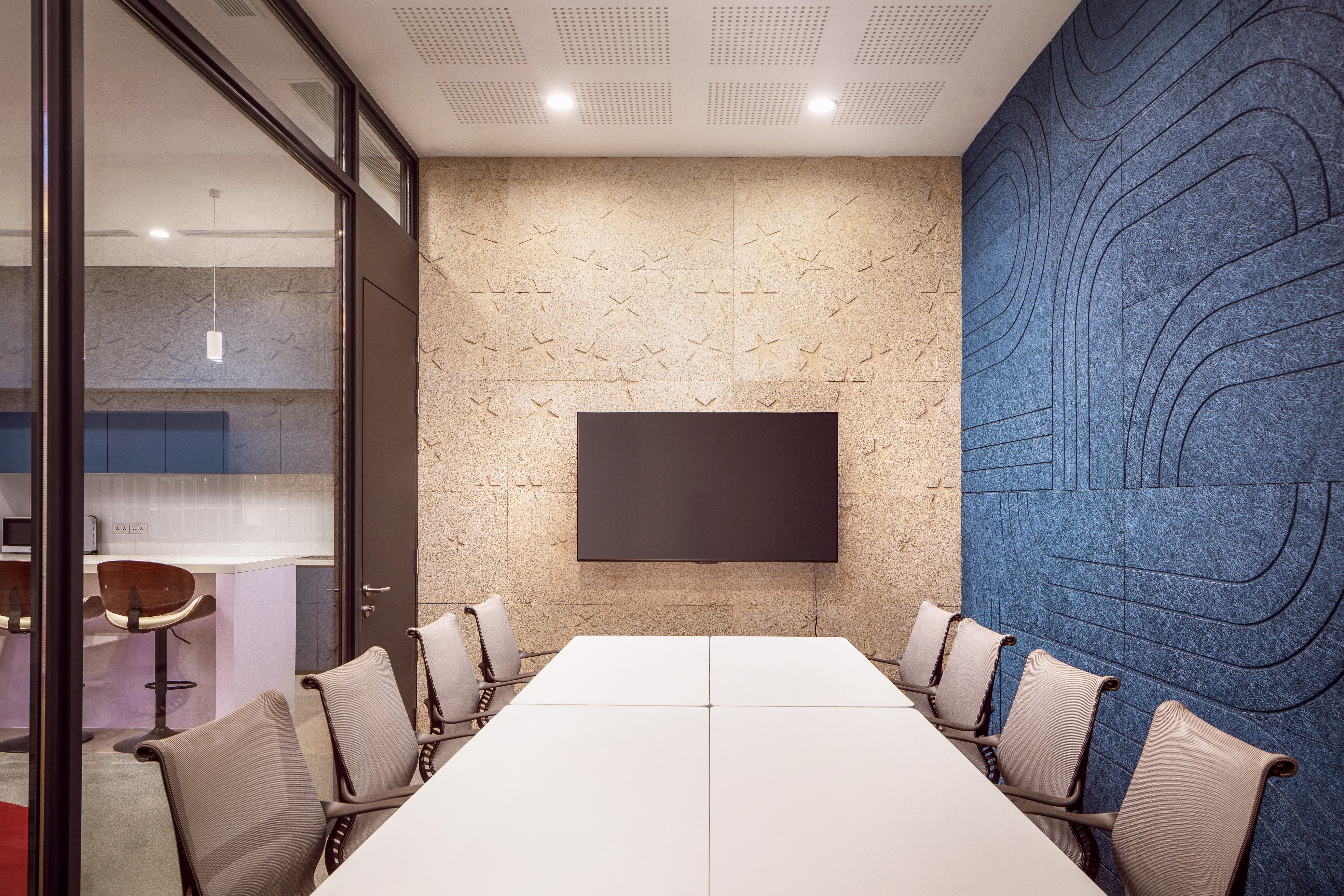 Flexible event space featuring a large skyline mural and adaptable seating for workshops.