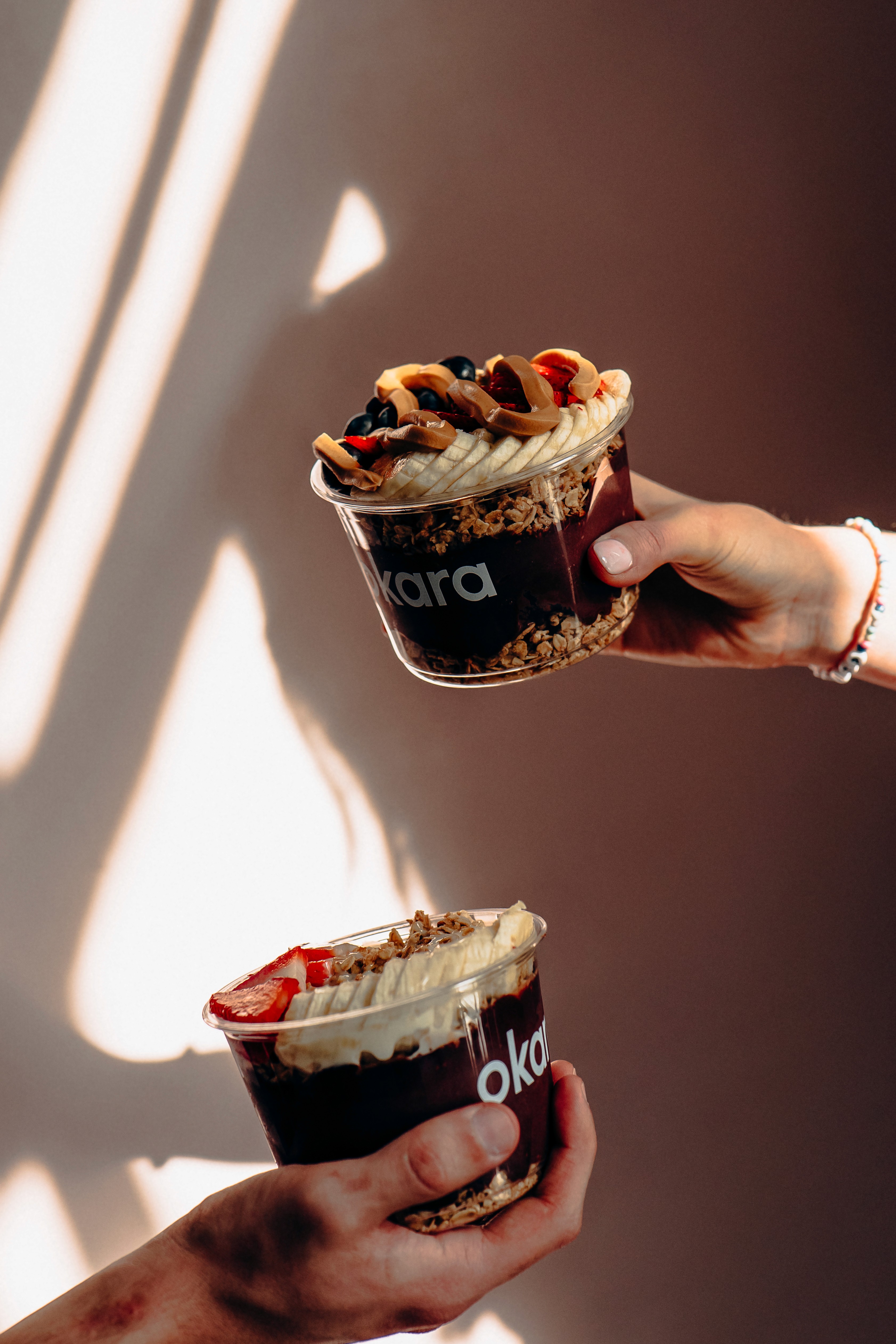 kids lying on a glass land and smiling