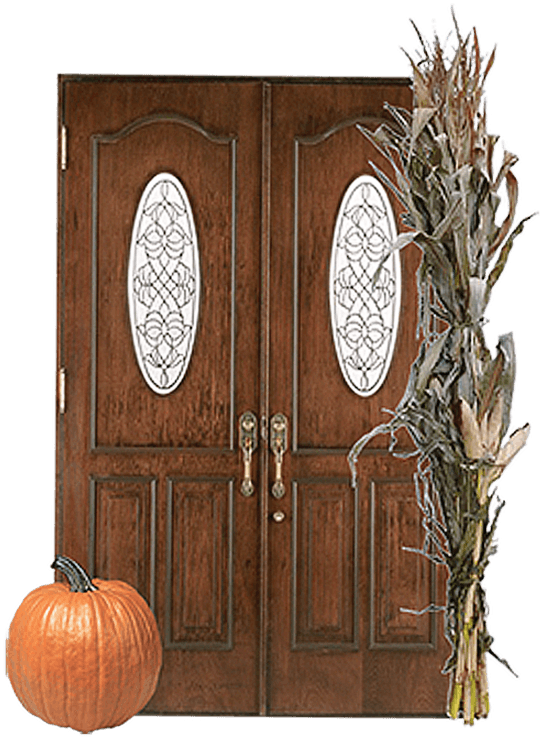 A home door, with a corn husk and a pumpkin on its porch