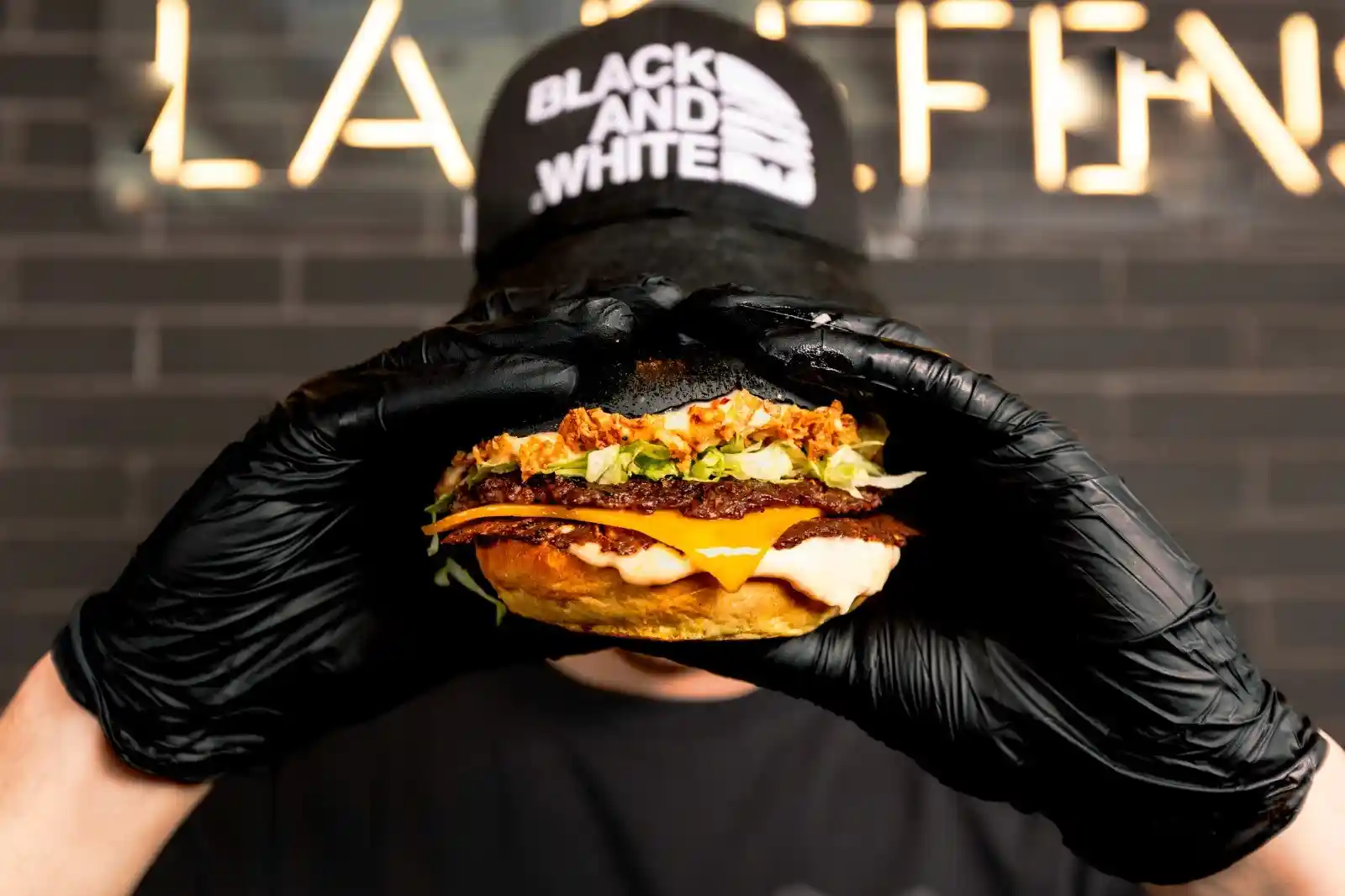 White sign on concrete wall, reading "LOREM IPSUM" and "20 24"