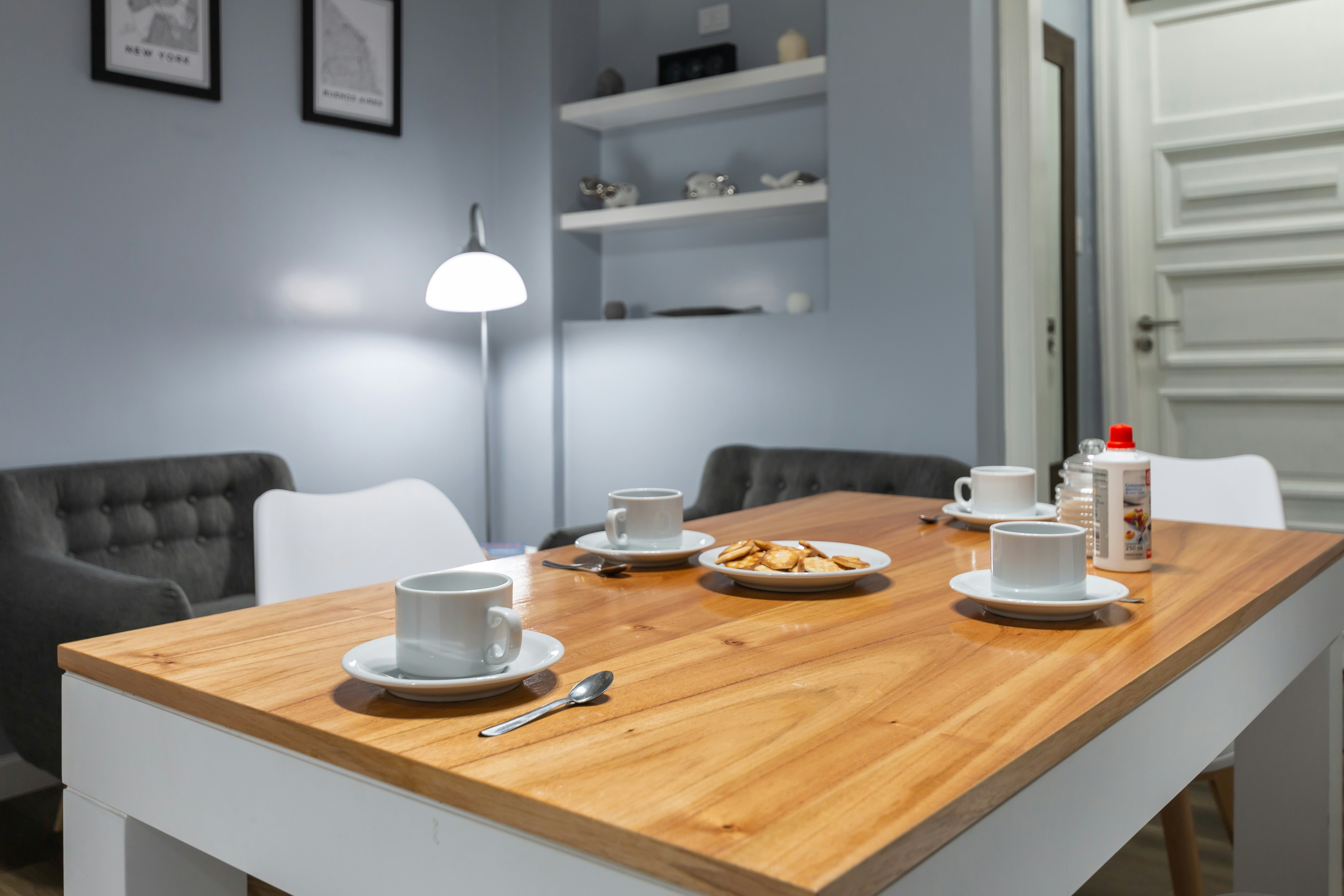 white ceramic mug on brown wooden table