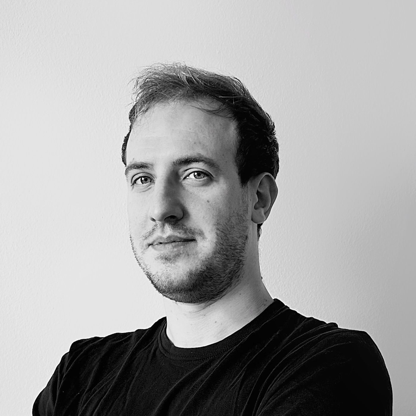 grayscale photography of man wearing crew-neck shirt