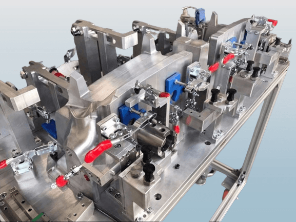 Steel workholding clamp on a machine bed