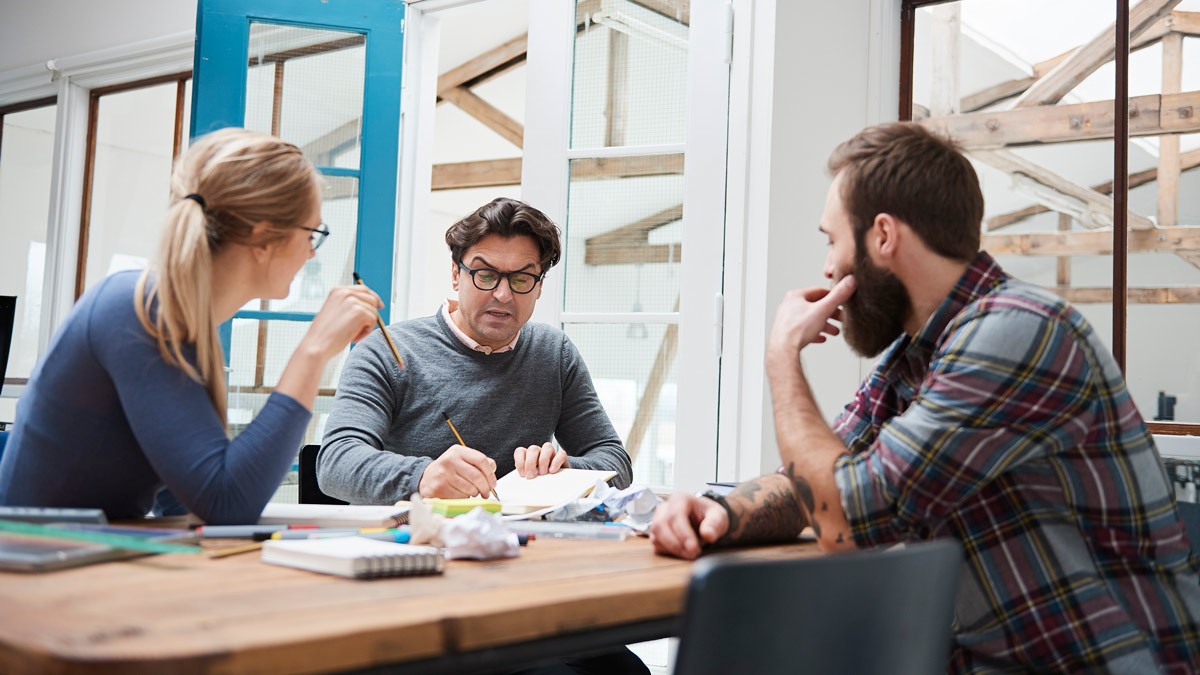 Co-workers working together during a brainstorm meeting