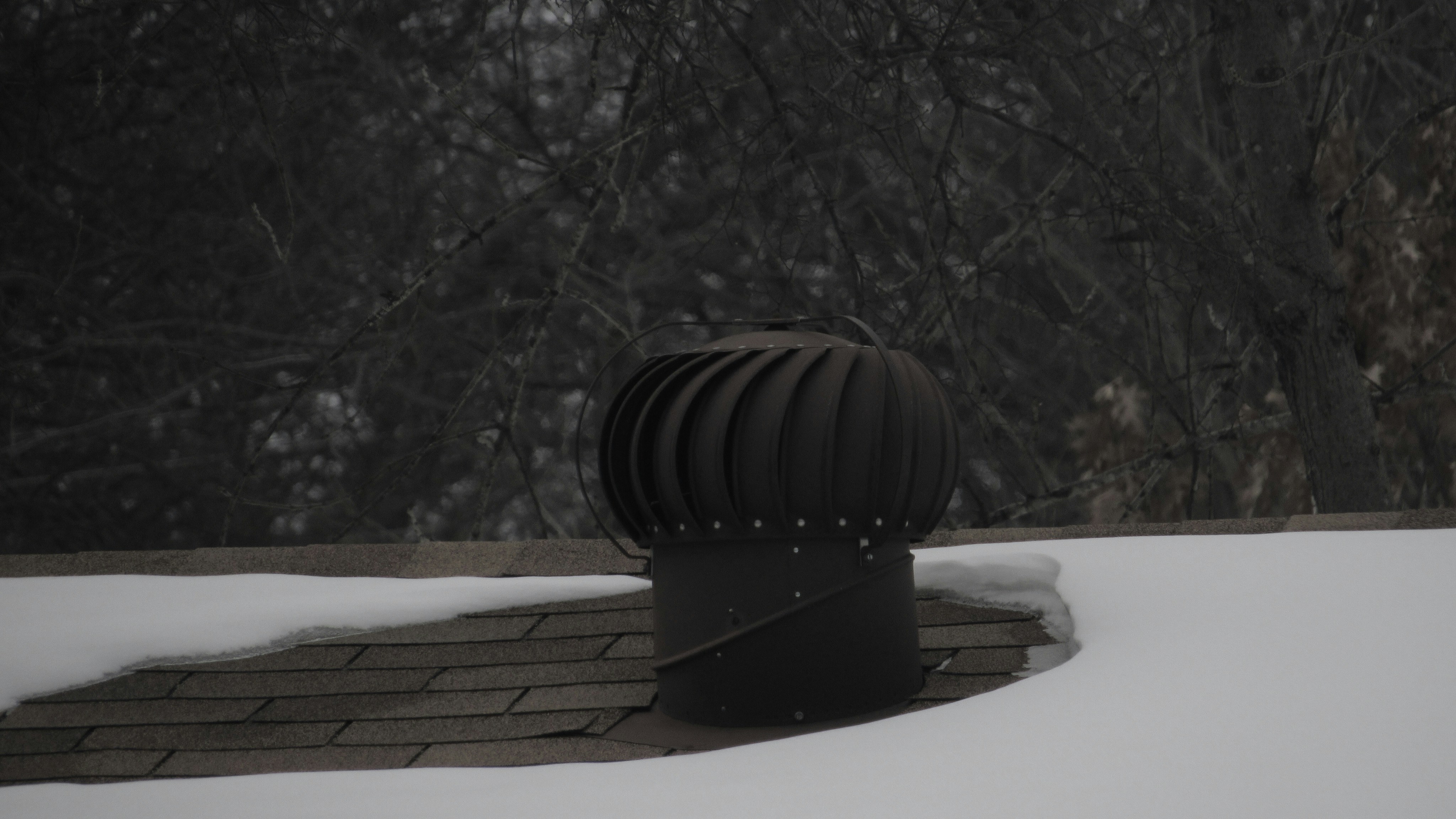 a close up of a rain gutter on a roof