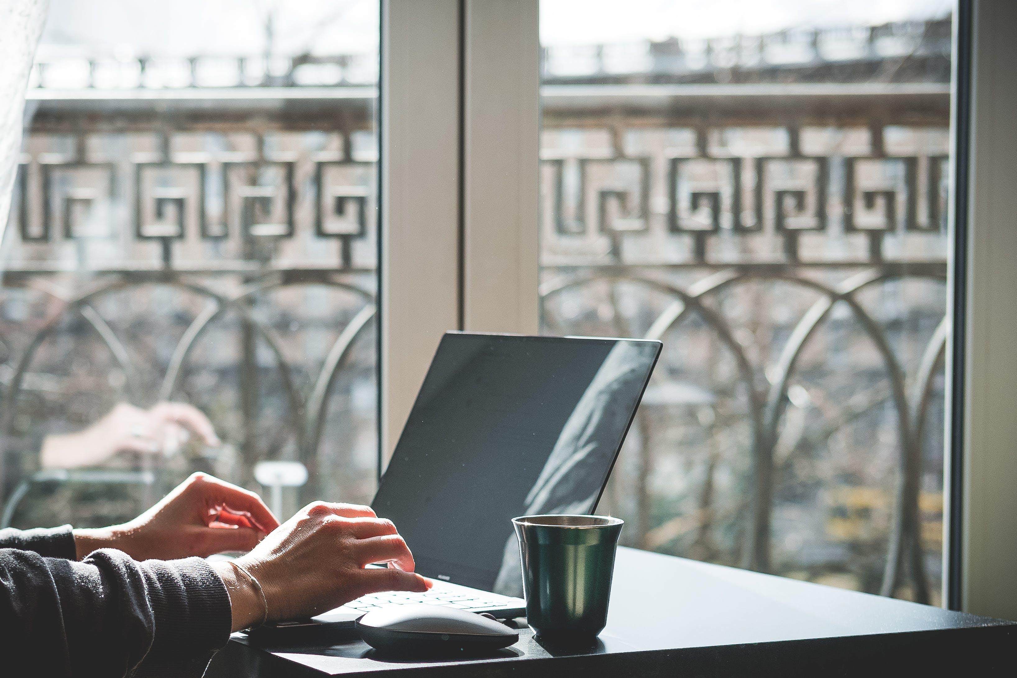 Businessman using macbook sending cold emails and replying to responses