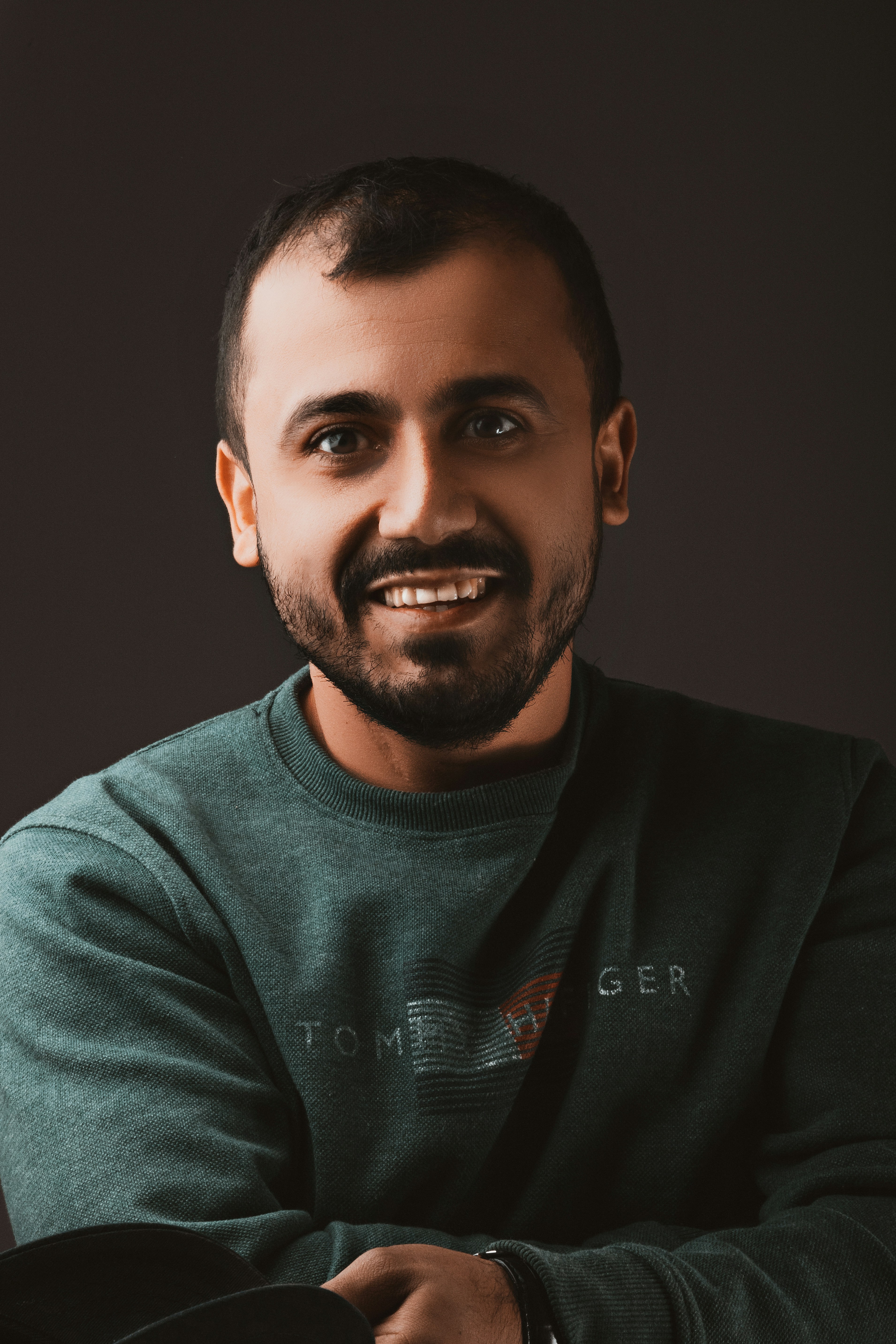 A man's portrait represents a client.