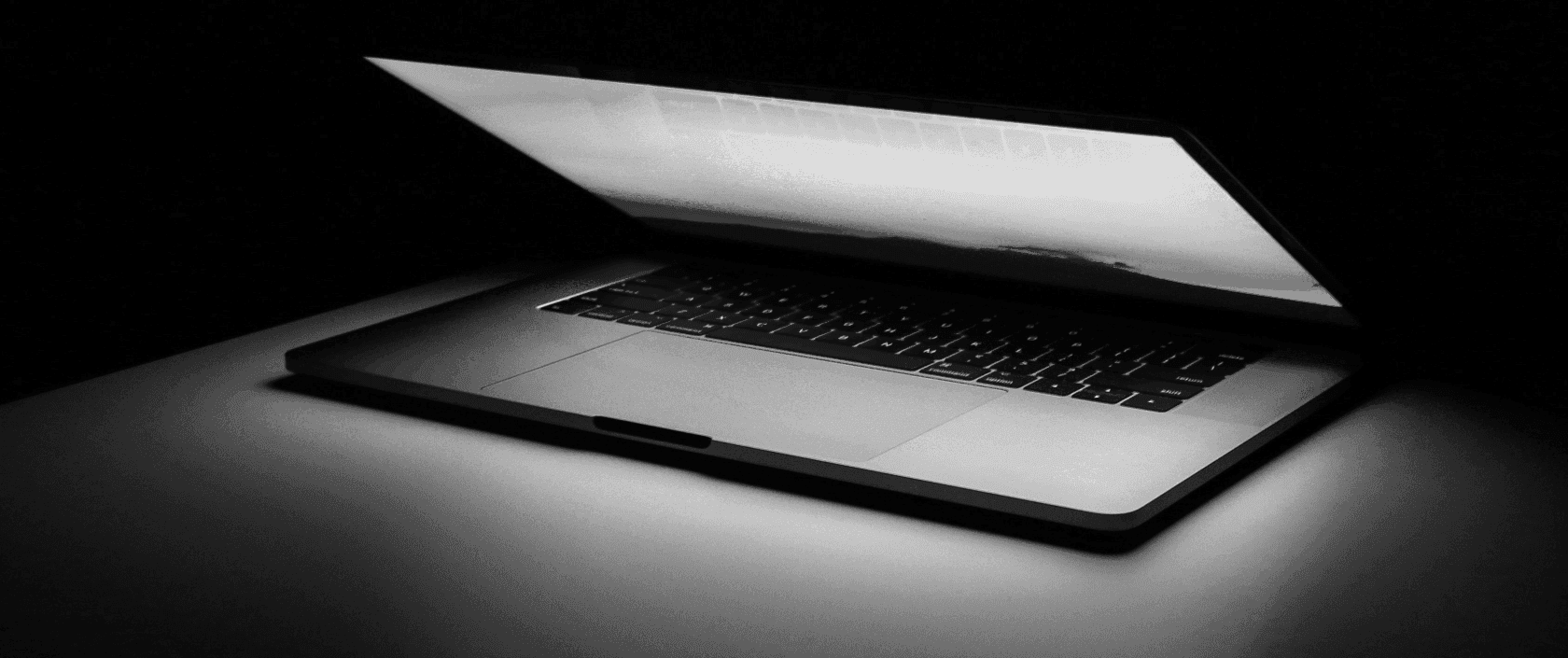 gray and black laptop computer on surface