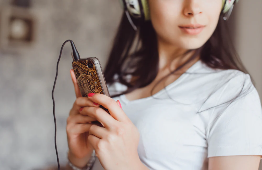 woman using android phone - Music Making Apps for Android