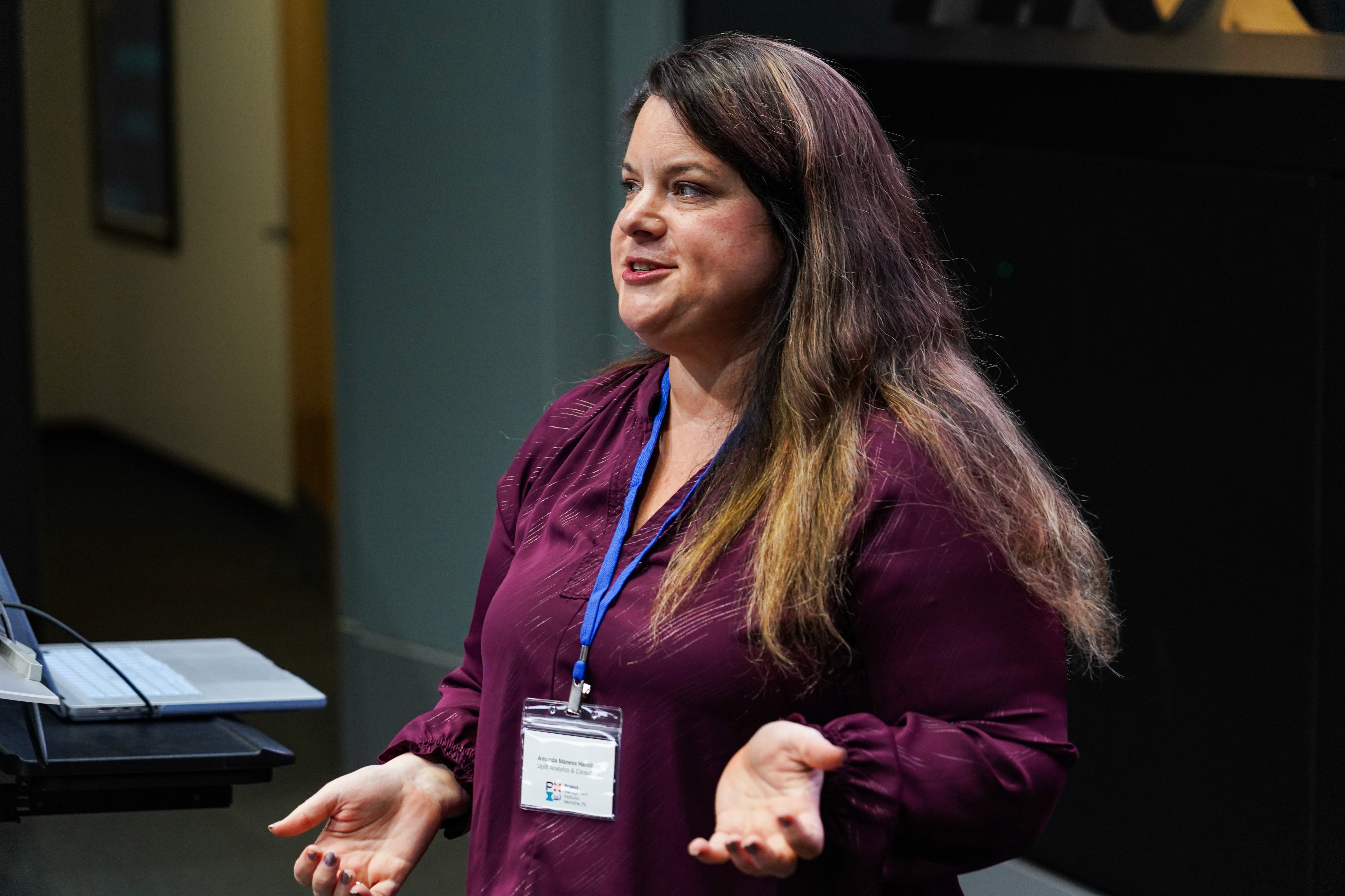 Profile portrait of a man in a white shirt against a light background