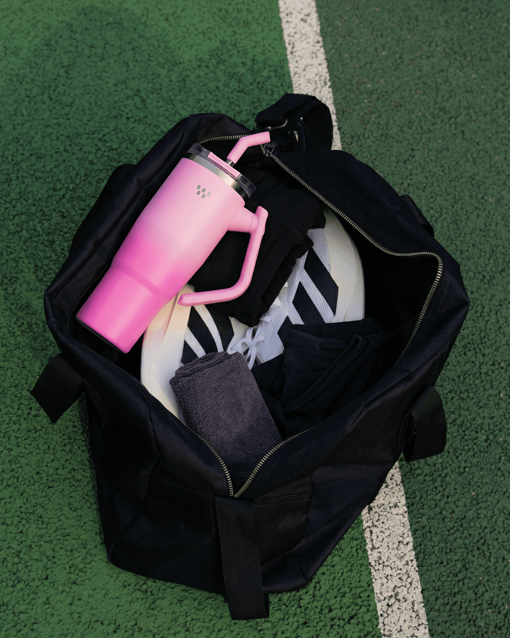 Young woman with blonde hair wearing a dark hoodie.