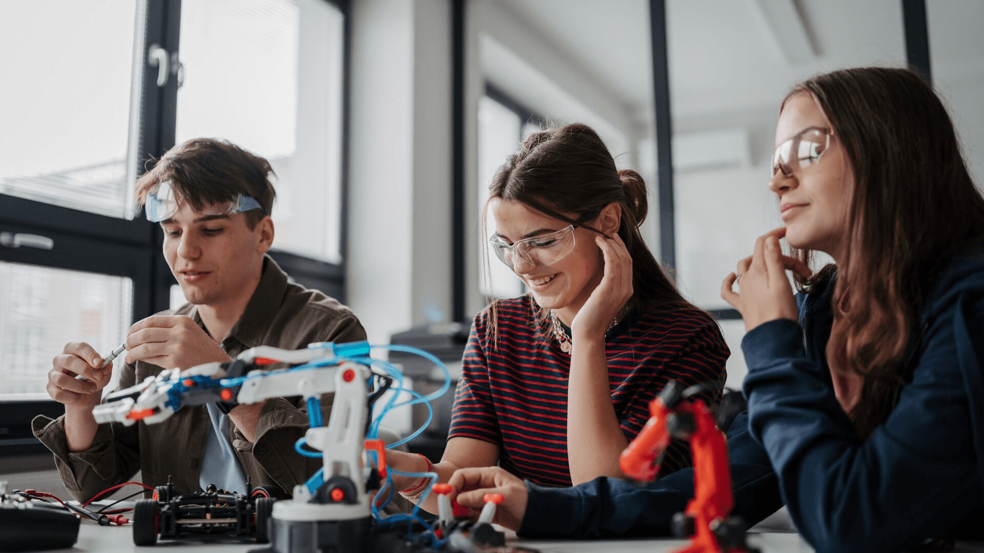 High school student working on original research paper with PhD mentor guidance for university admissions