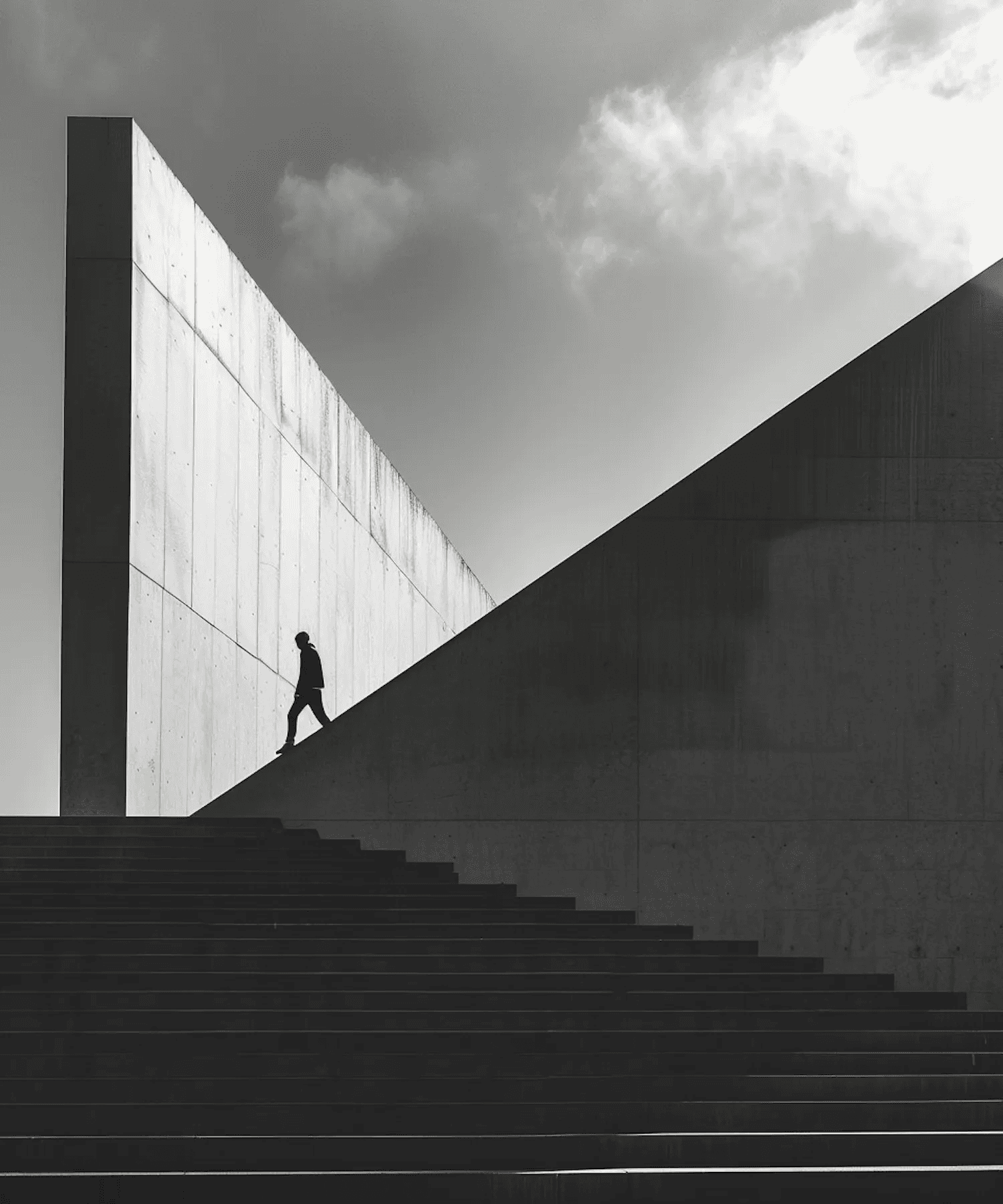 Lone Figure Amidst Concrete Giants