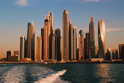 Dubai Marina towers seen from the water at sunset