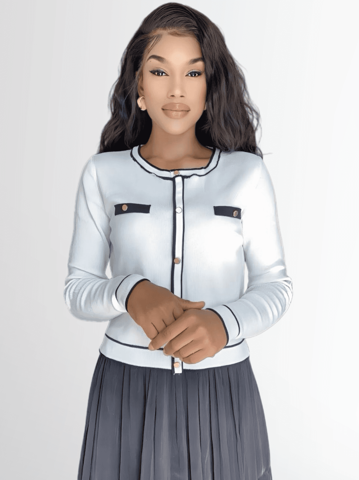 A woman in a white cardigan and skirt stands confidently, representing faith and leadership in a community-focused ministry.