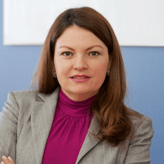 two people looking at a tablet and smiling