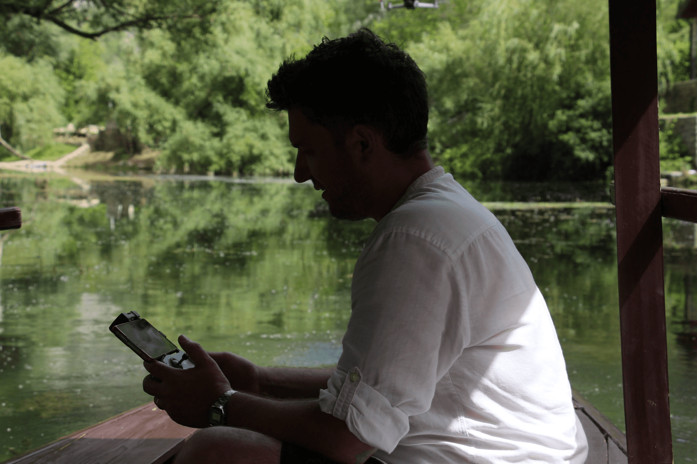 A man on the phone on the river in Bosnia
