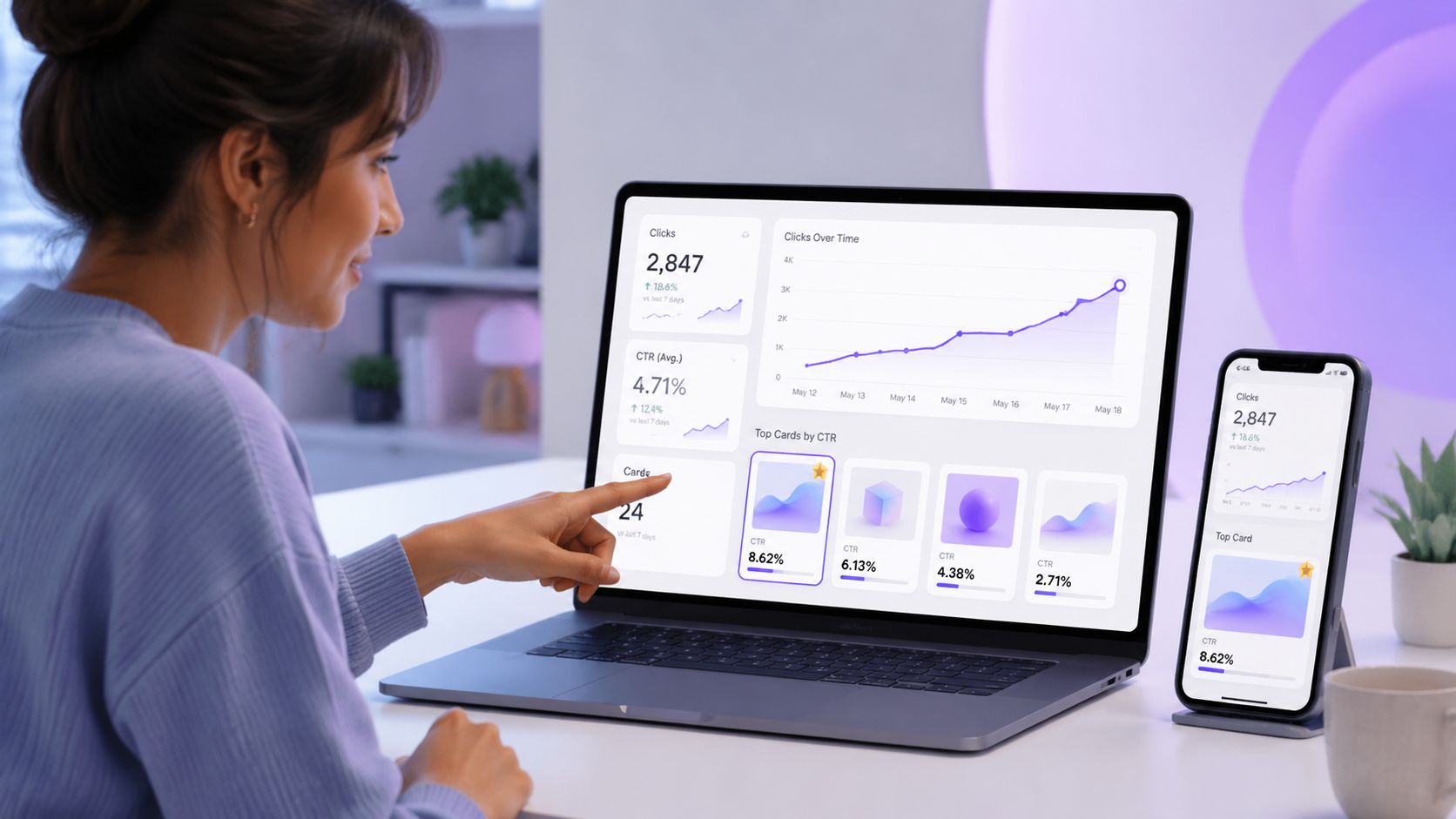 A professional woman reviews digital marketing analytics on a laptop screen and smartphone at her desk.