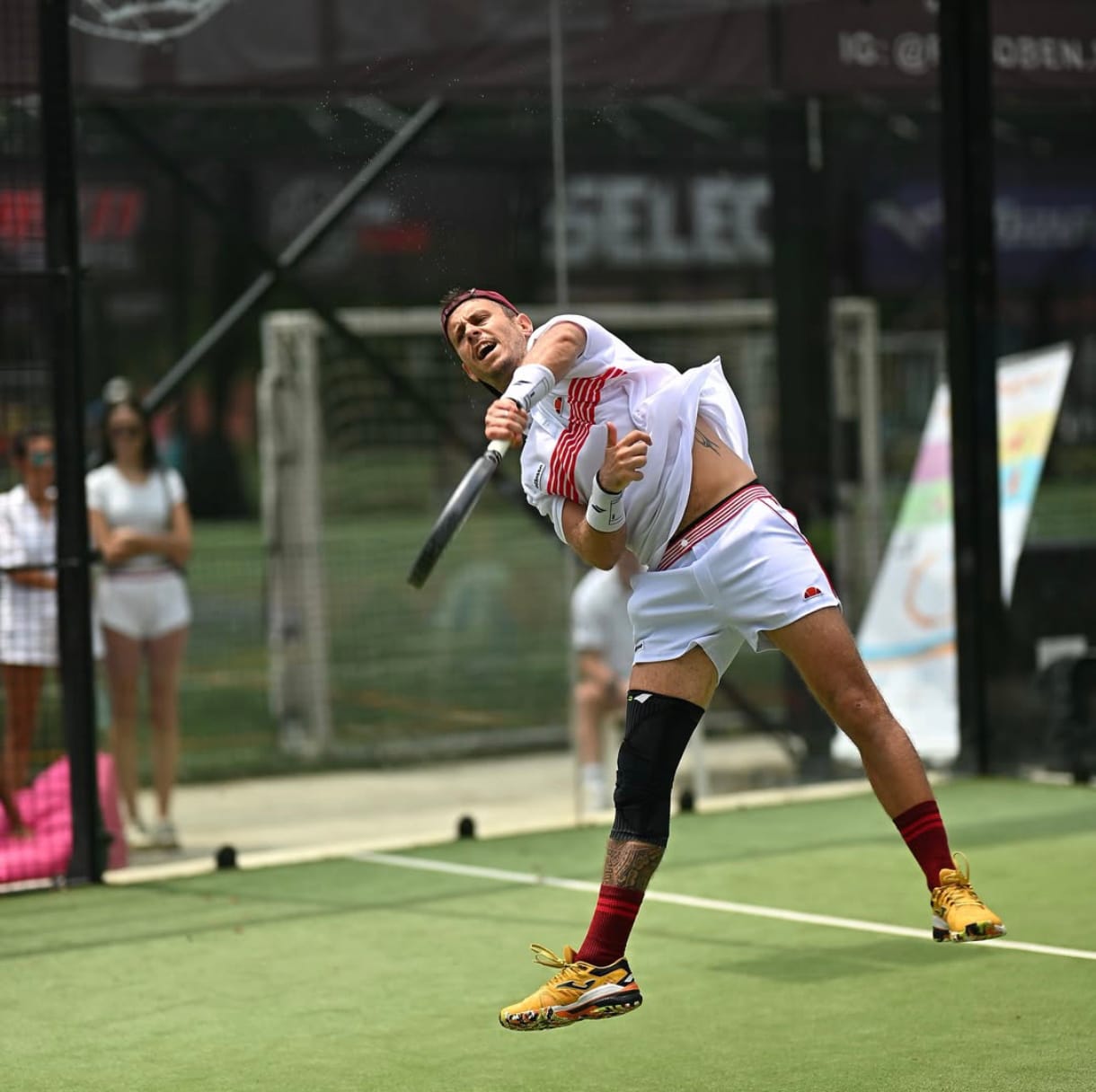 woman holding tennis ball and racket