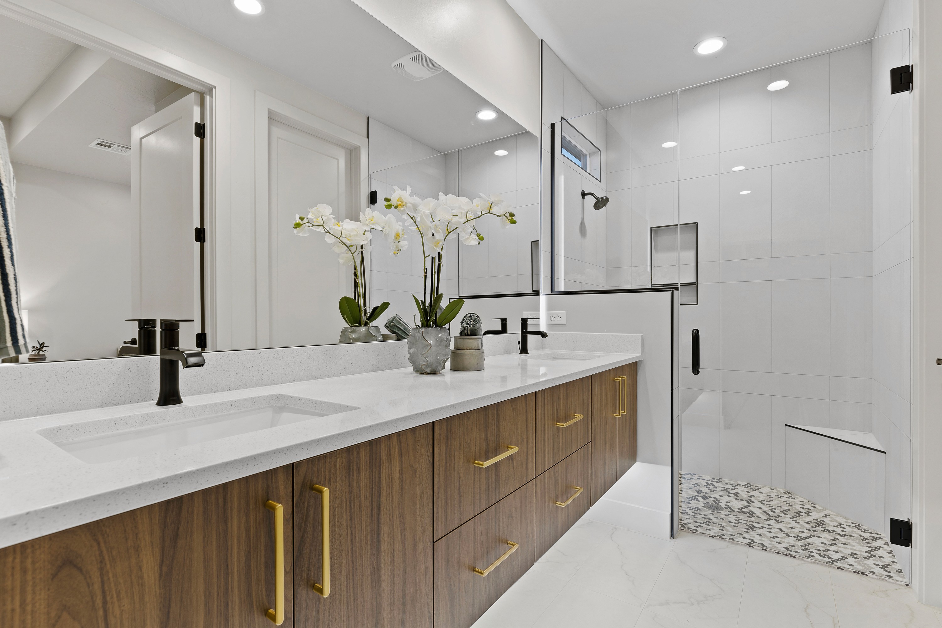Primary bathroom inside The Painted Horizon twin home in Hurricane, Utah featuring a spacious vanity and modern finishes.