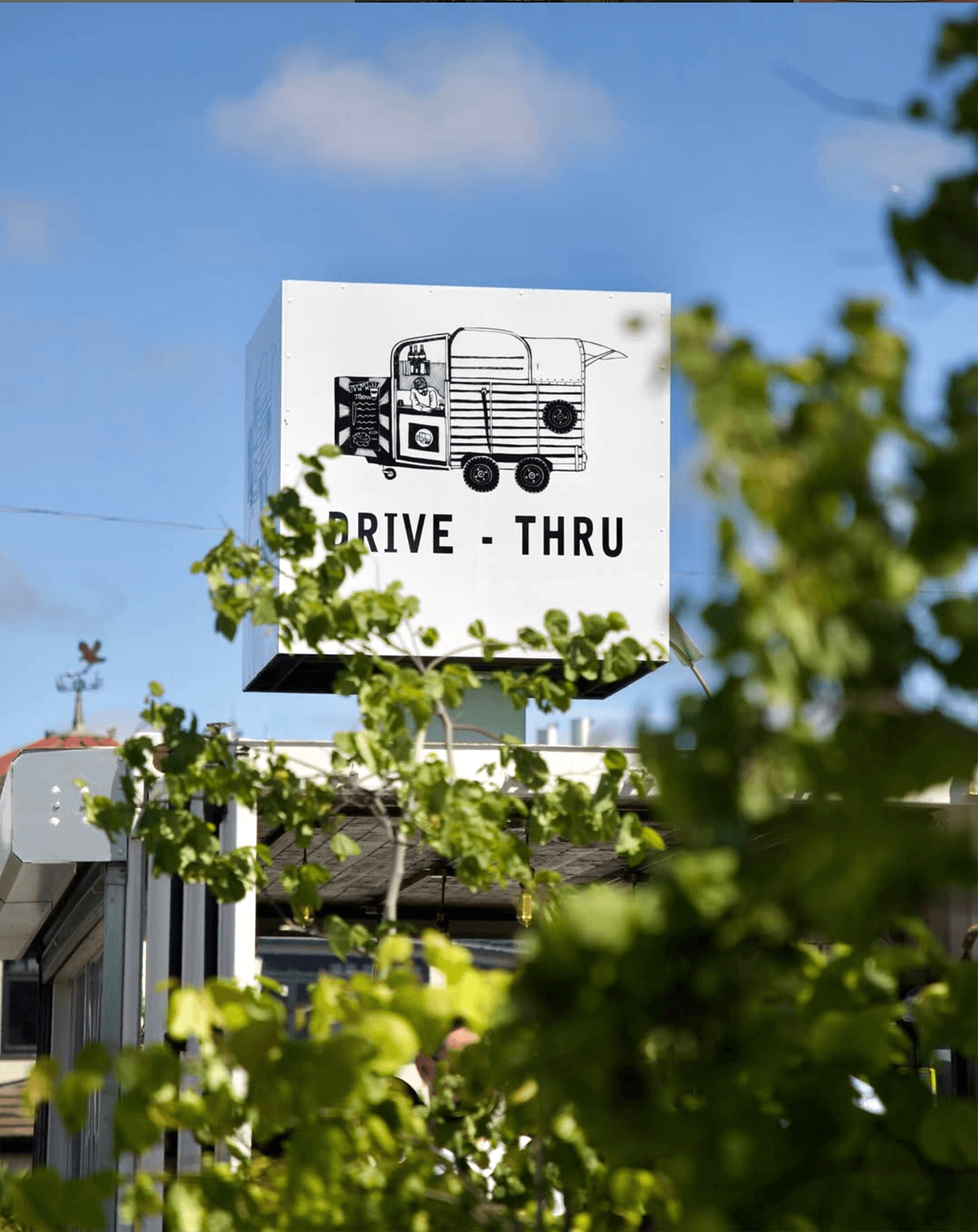 Green signage and café stall – Real-world brand install at Irish market event.