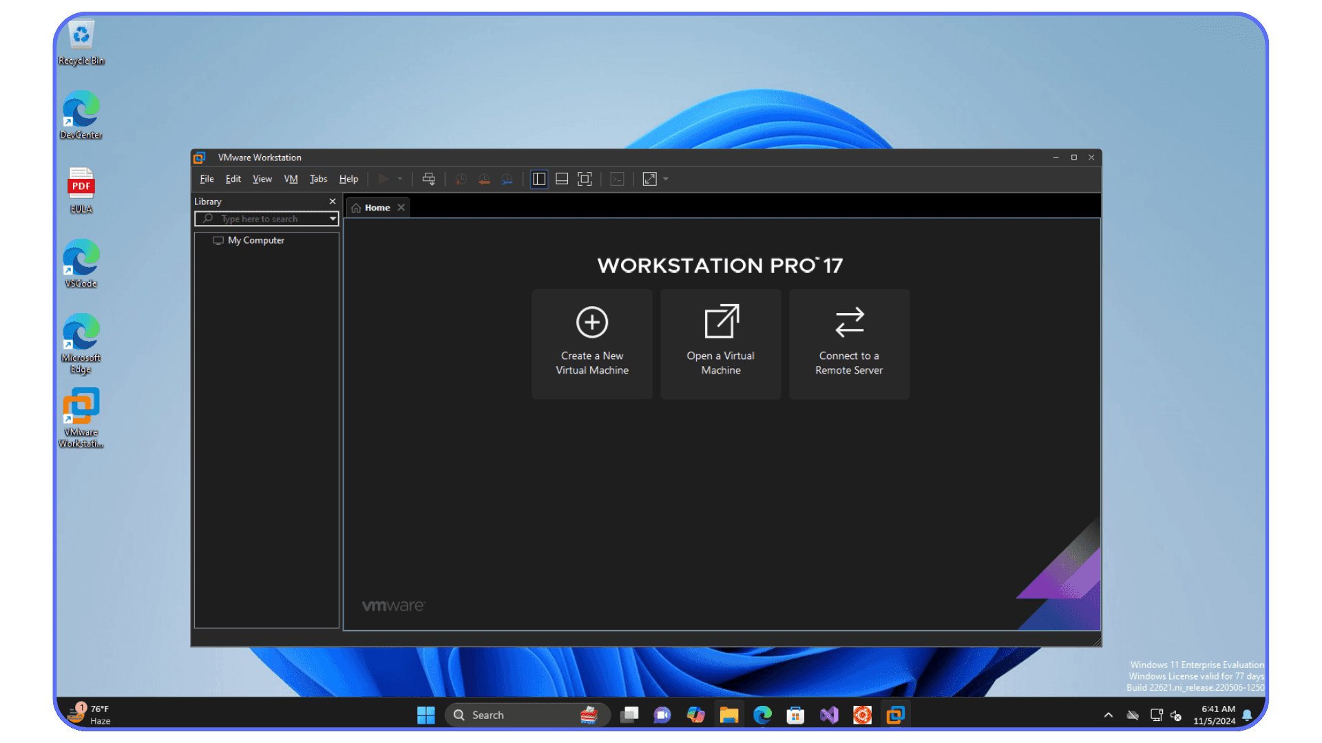 VMware Workstation Pro 17 home screen open on a Windows 11 desktop, showing options to create a new virtual machine, open an existing virtual machine, or connect to a remote server.