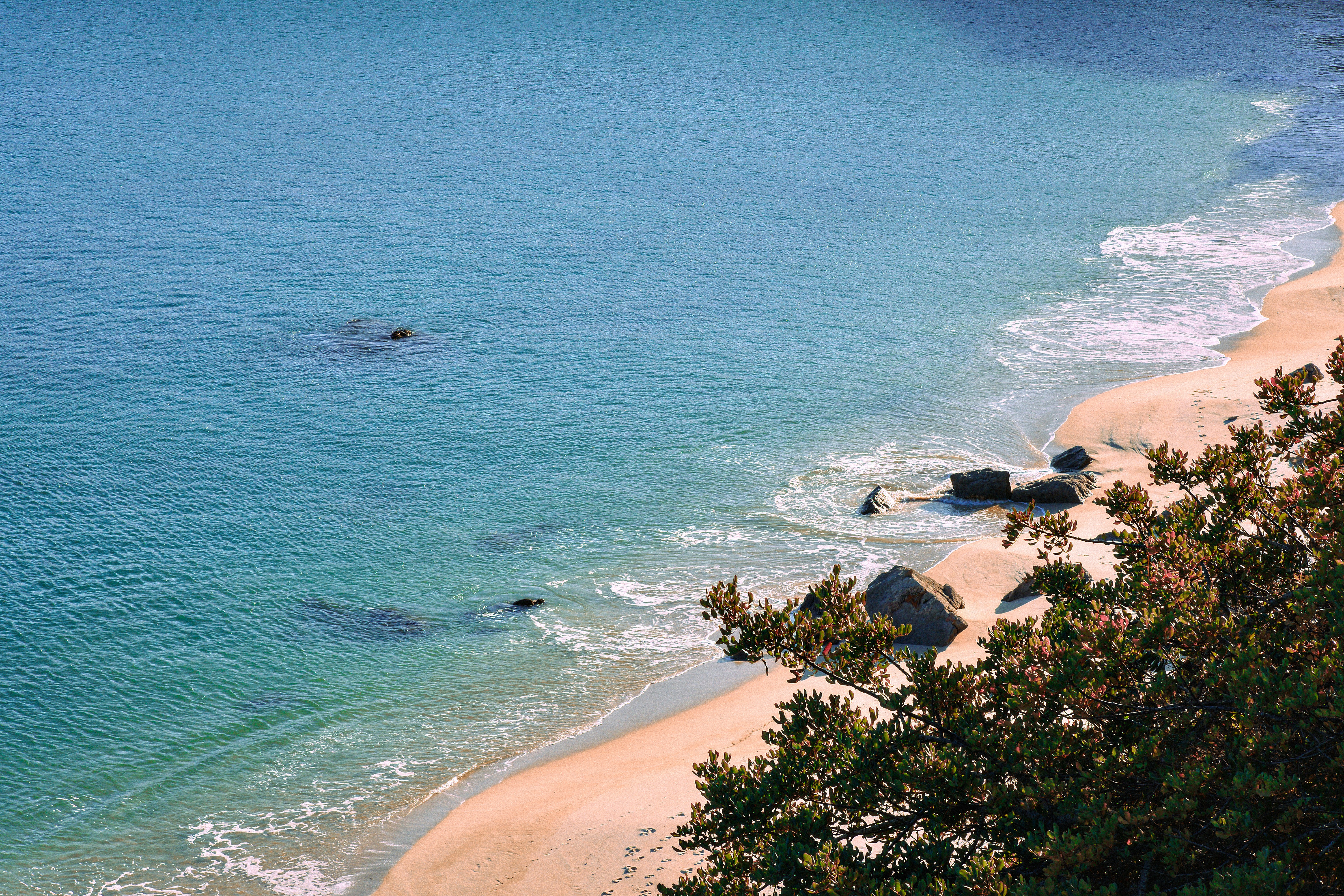 a view of a beach with a boat in the water