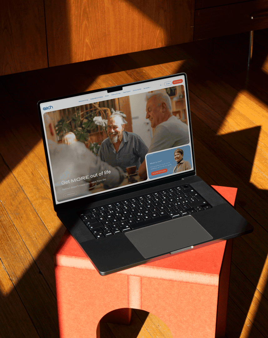 The 'ECH' Website displayed on a laptop sitting on a bench.