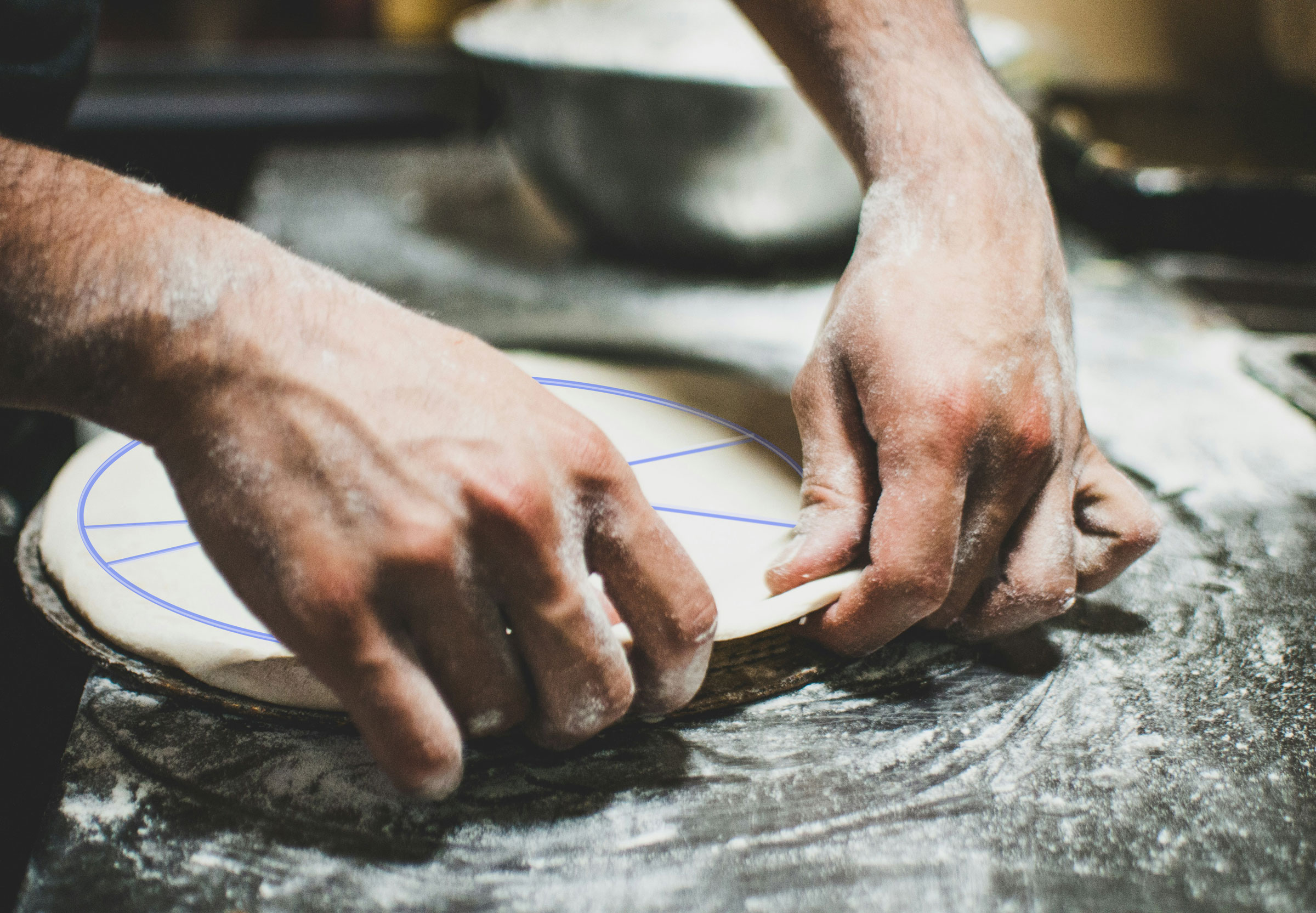 Hands shaping fresh pizza dough on a floured surface, representing the foundational “core” of an income portfolio before tactical satellite elements are added.