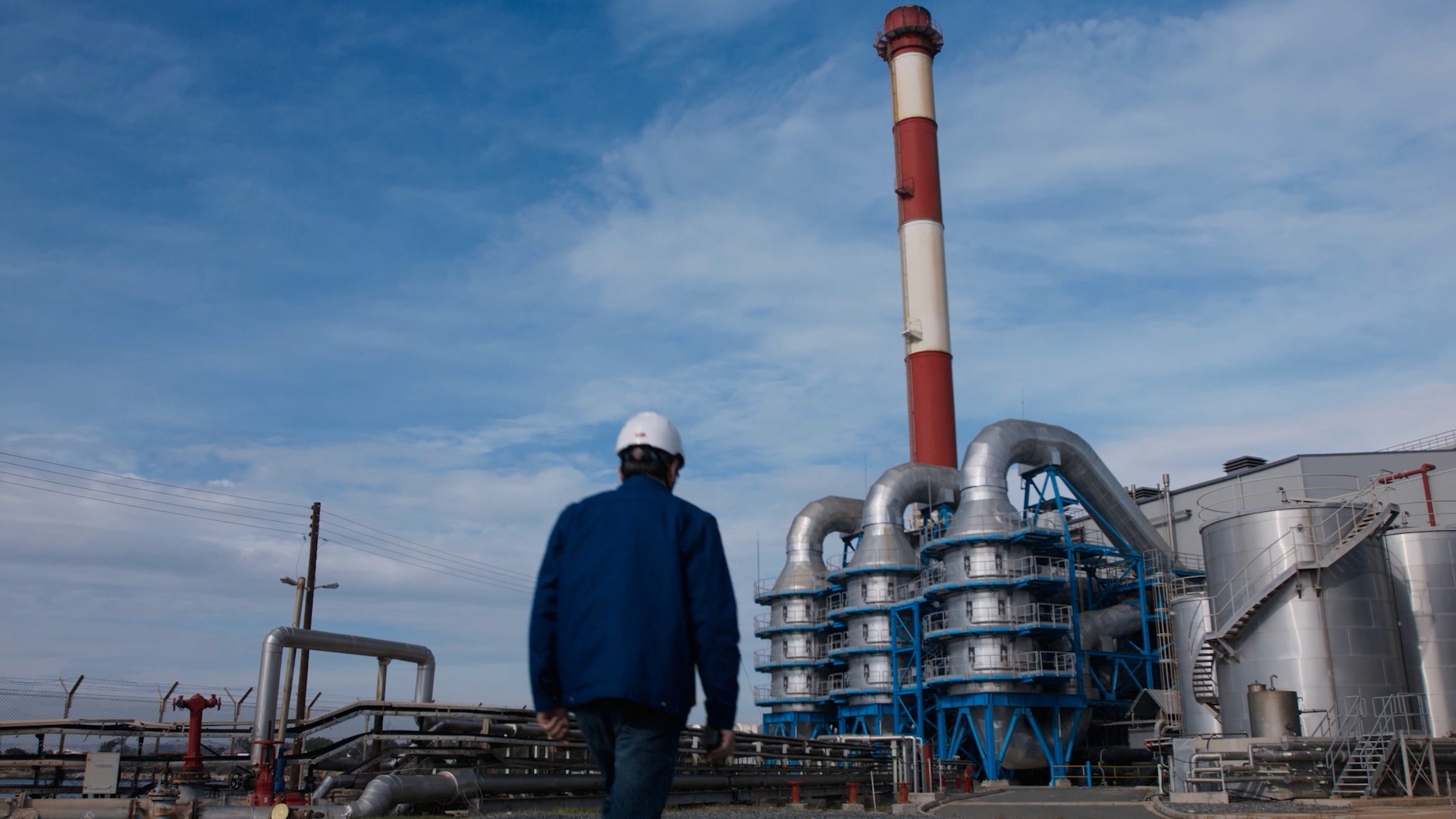 A worker of Electricity of Cyprus walking in the electrical station of Dekhelia for the needs of corporate videography for EAC needs