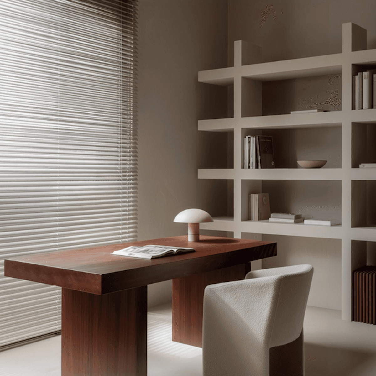 A warm modern office interior with wooden furniture and shelving