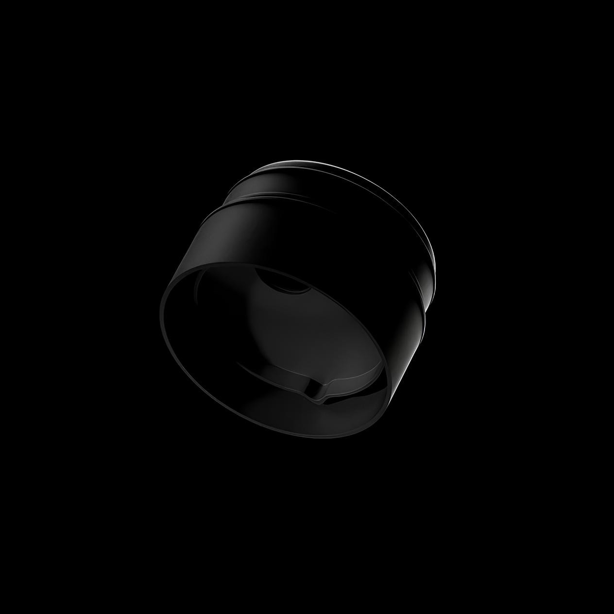 A sleek, black camera lens cap shown against a dark background. The cap is slightly angled, highlighting its smooth, matte surface and curved edges.