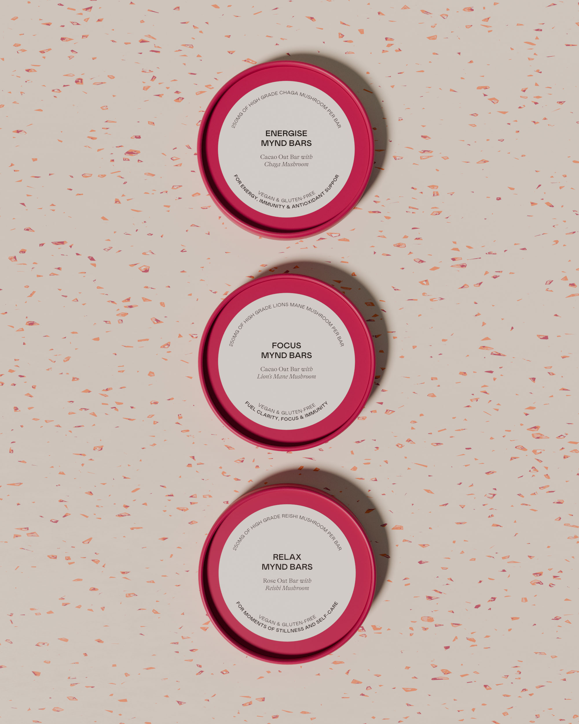 Three pink cup lids for Mynd Bars viewed from above on a terrazzo surface, showing 3 product variants