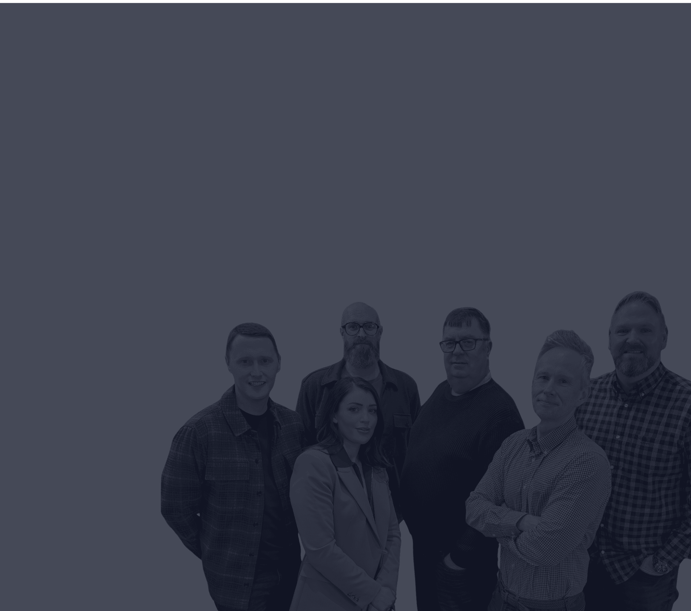 Three people sitting on a couch in a room looking at mobile devices