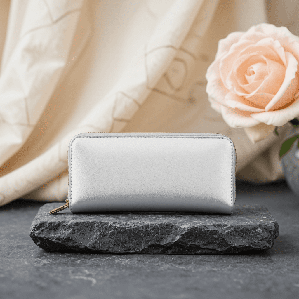 product photography of a small silver wallet with a zippered compartment