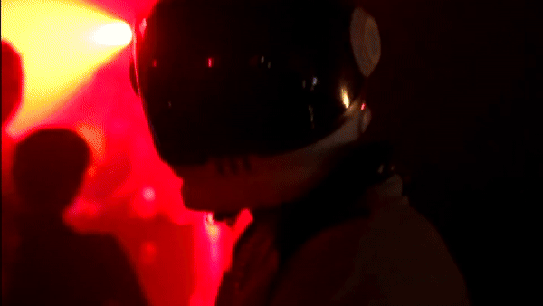 Bride in white dress walking on street, blurred motorcycle passing