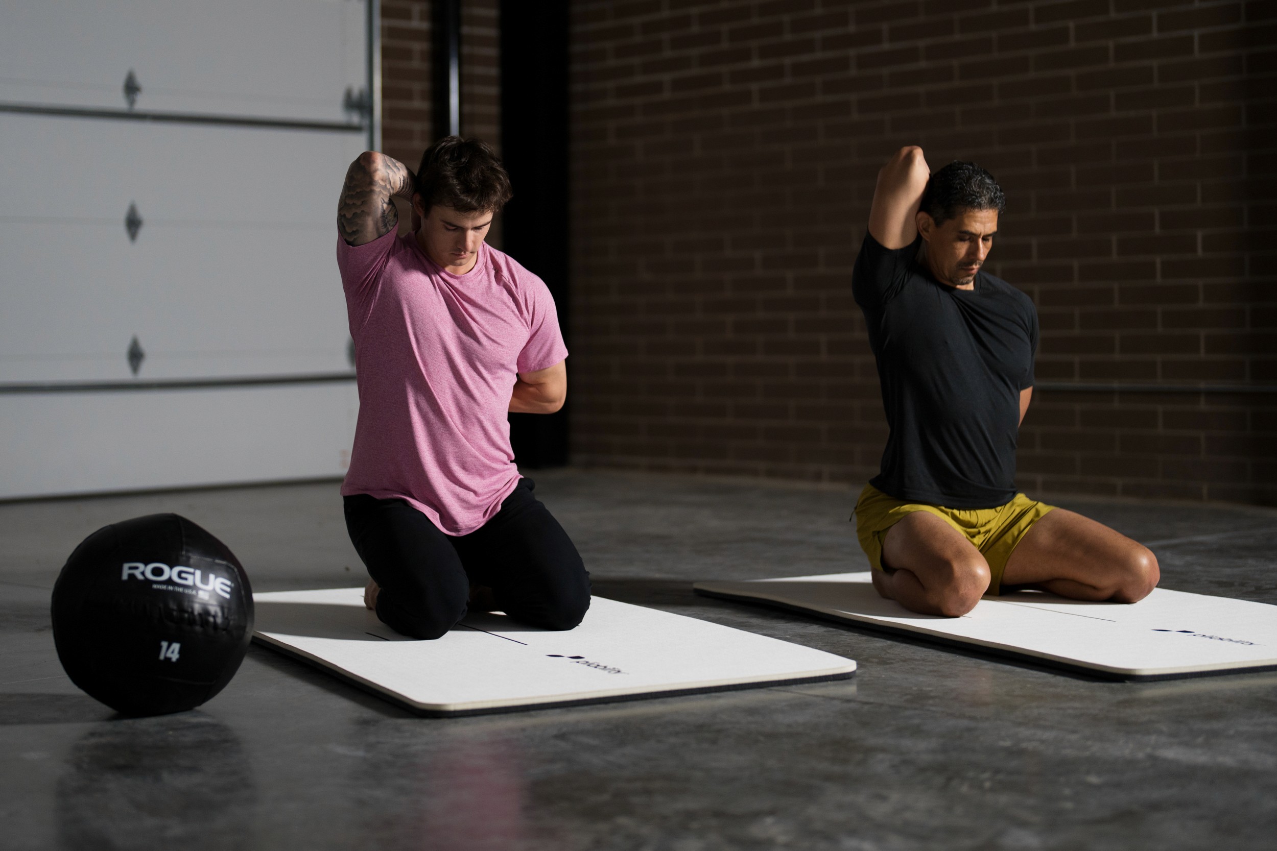 person stretching arms - Seated Stretches