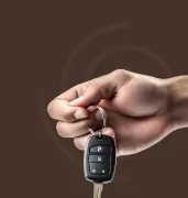 Person inserting coin into piggybank