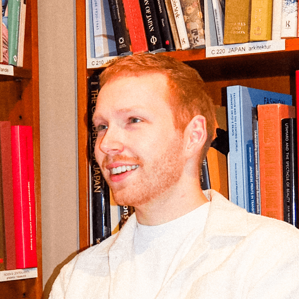 Frederick smiling in an office.
