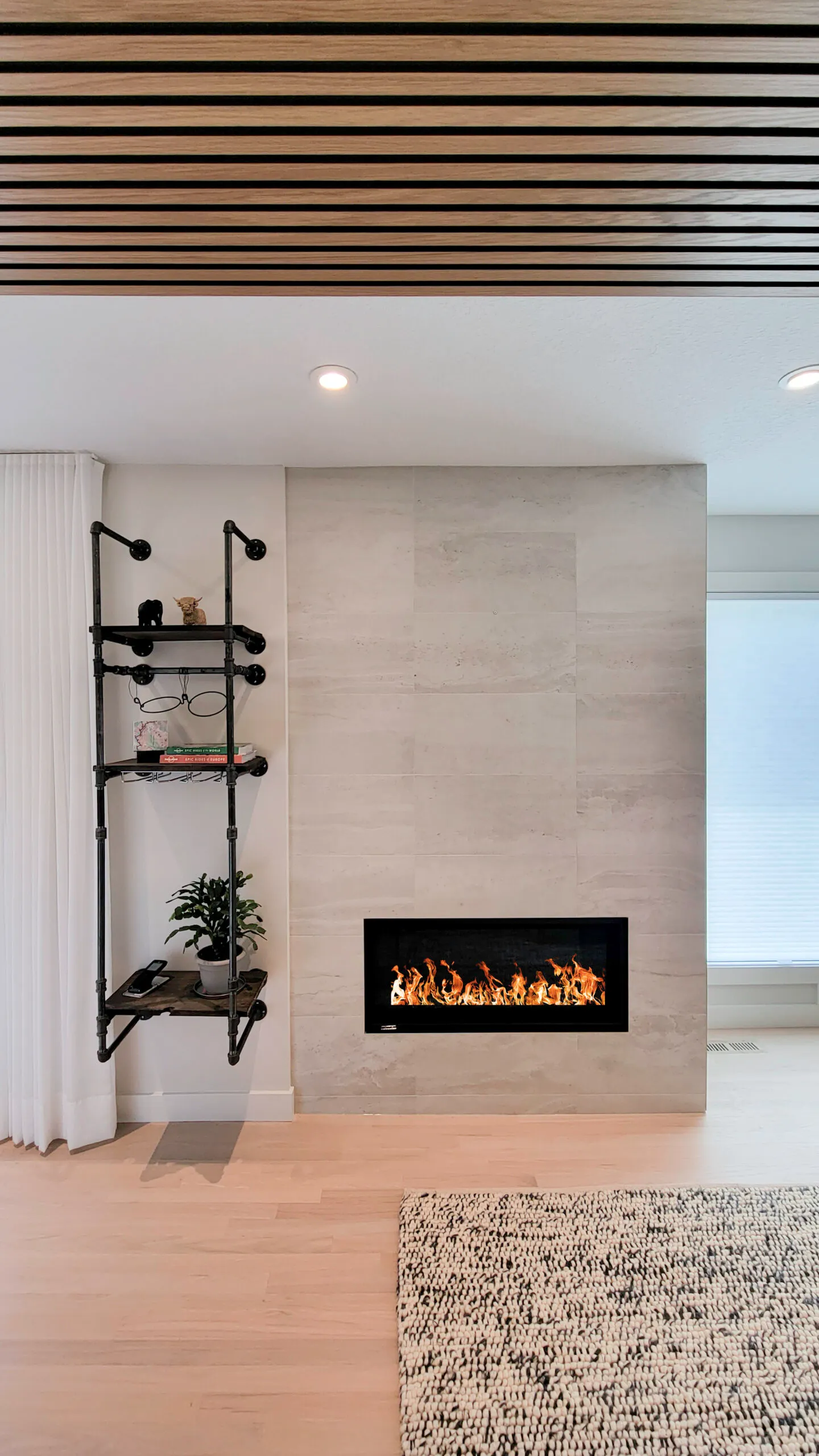 Image of fireplace with smooth modern stone tile.