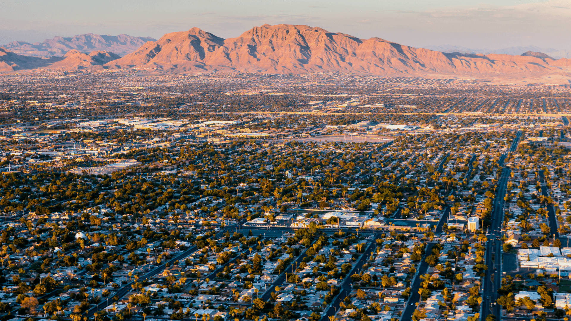 Aerial view of Las Vegas residential neighborhoods and surrounding mountains