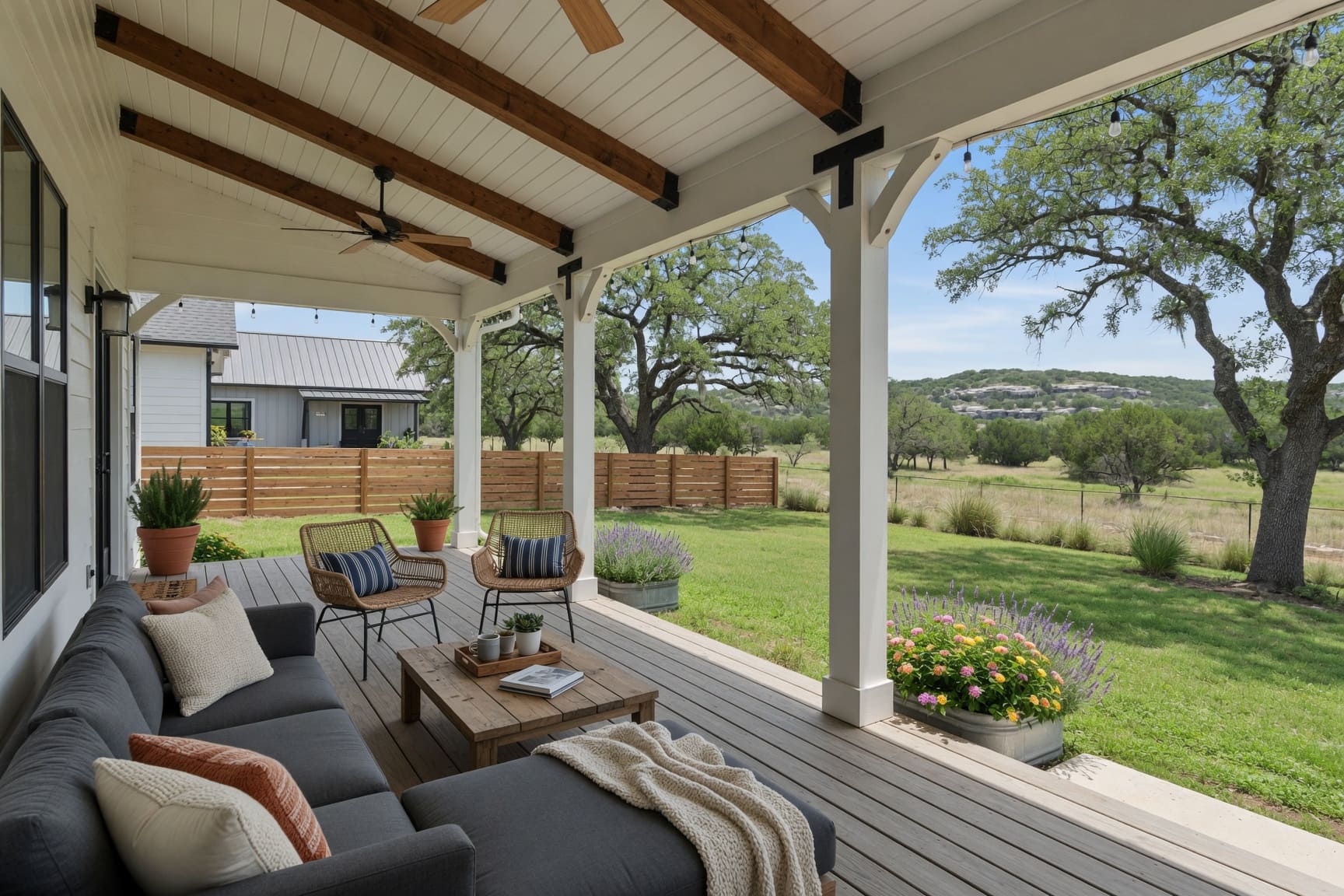 Covered back porch with outdoor seating and Hill Country views